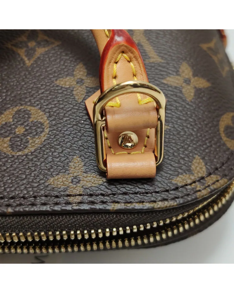 Louis Vuitton Nano Alma, close up light wear on the hardware