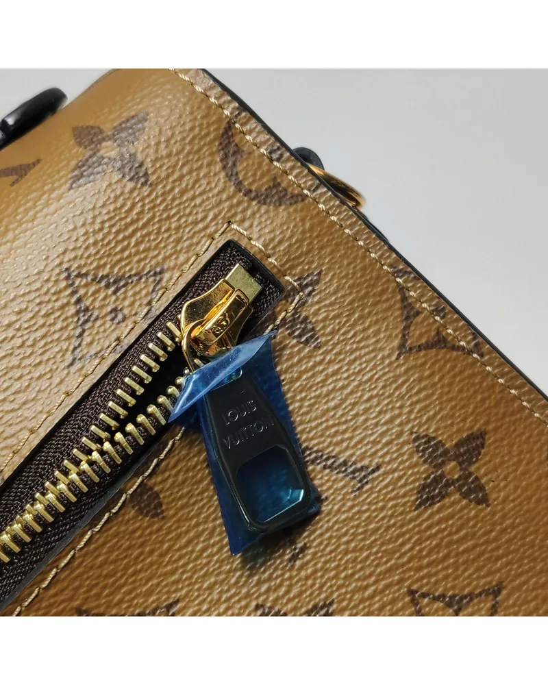 Louis Vuitton Pochette Métis MM, close up light wear on the hardware