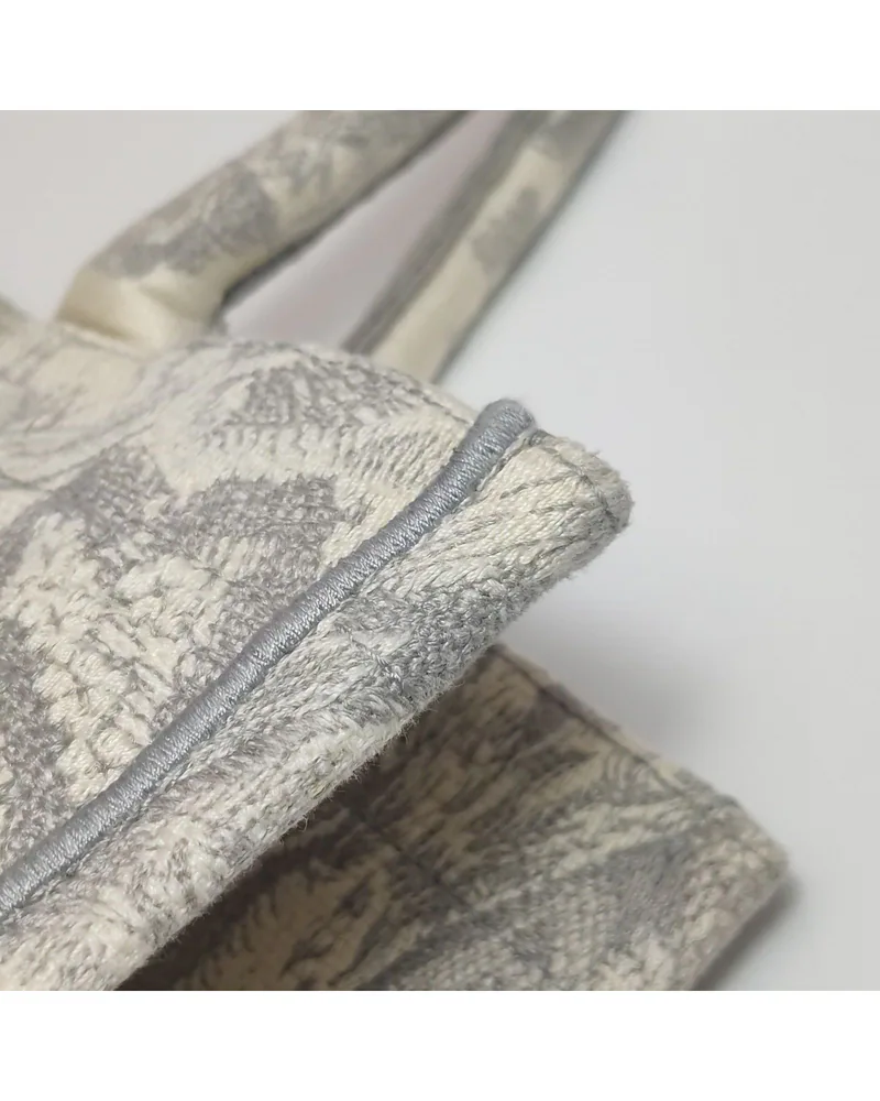 Dior Book Tote Medium, Toile de Jouy, close up light wear on the body