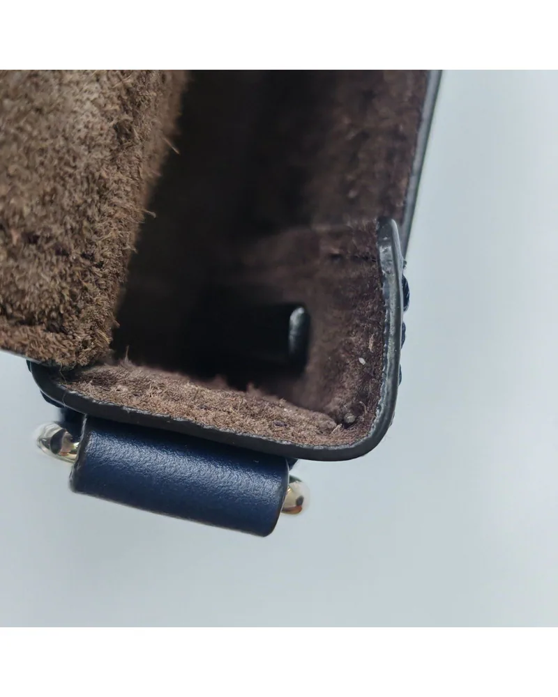 Fendi Baguette Soft Trunk Mini, close up light signs of repair on the lining