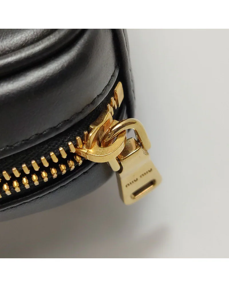 Miu Miu Beau Micro, close up light wear on the zip