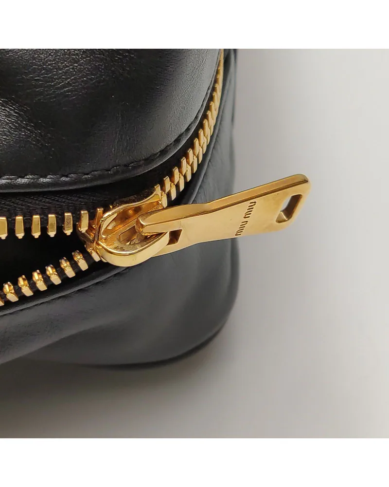 Miu Miu Beau Large, close up light wear on the zip