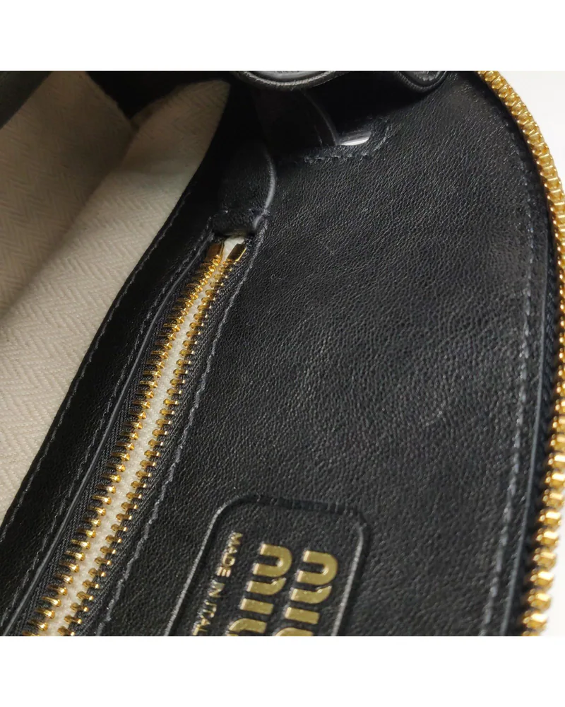 Miu Miu Aventure Crossbody, close up light marks on the lining