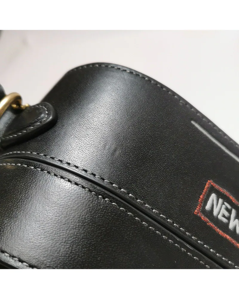 Coach Square Bag 18, Coach x Basquiat, close up light pressure marks on the body