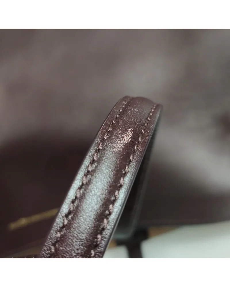 Alexander McQueen Basket Bag, close up moderate wear on the strap