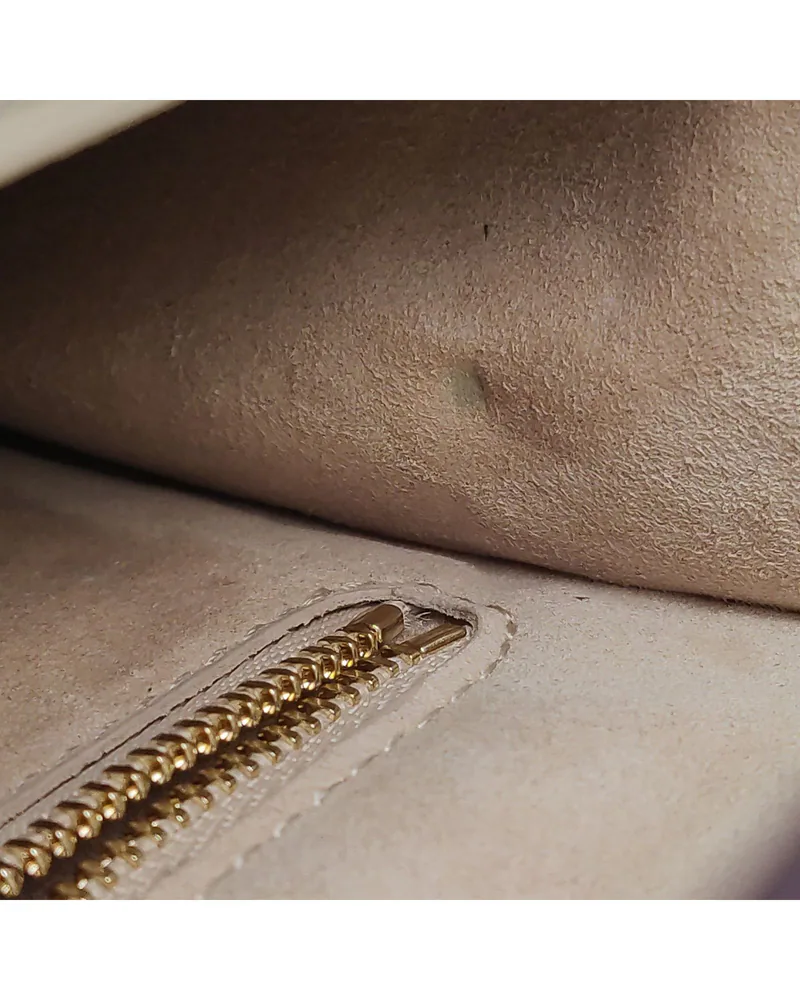 Alexander McQueen The Box Bag, close up light marks on the lining