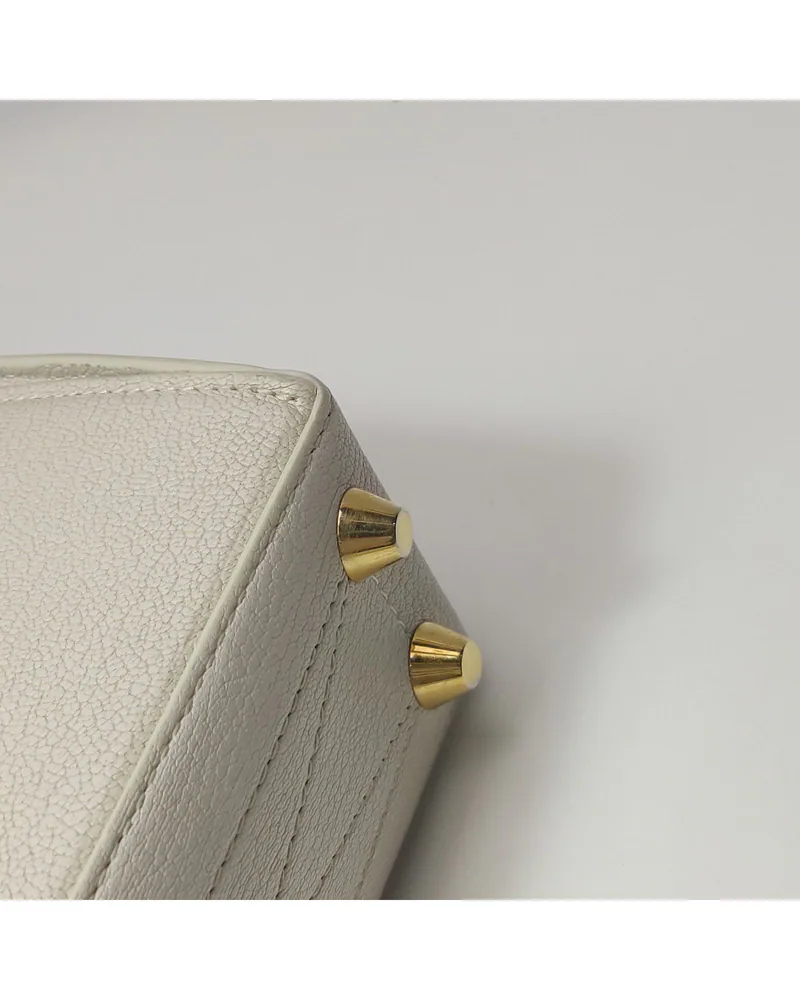 Alexander McQueen The Box Bag, close up moderate wear on the hardware