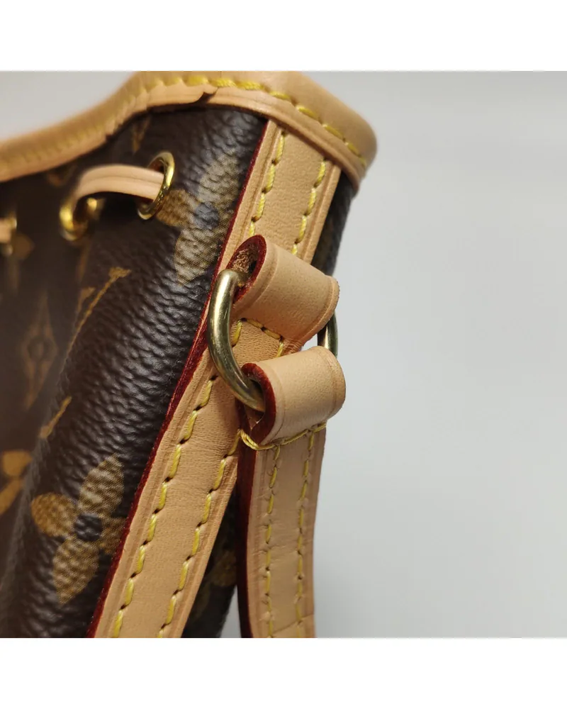 Louis Vuitton Nano Noé, close up light wear on the hardware