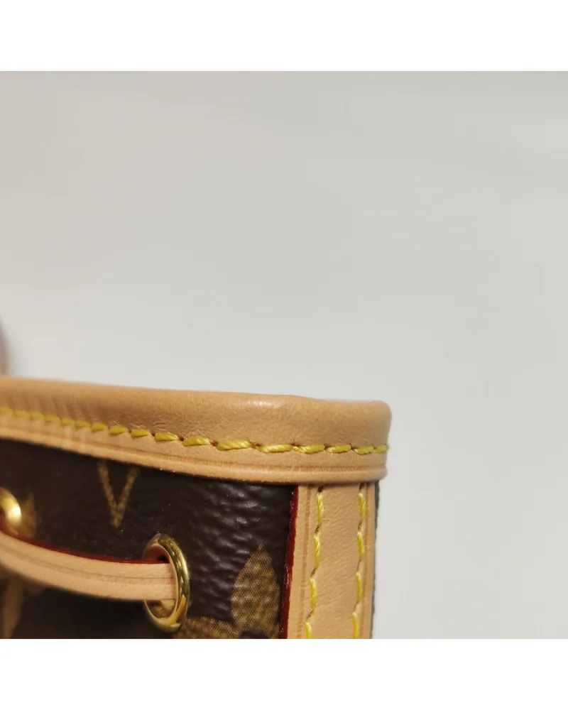 Louis Vuitton Nano Noé, close up light wear on the natural leather trim