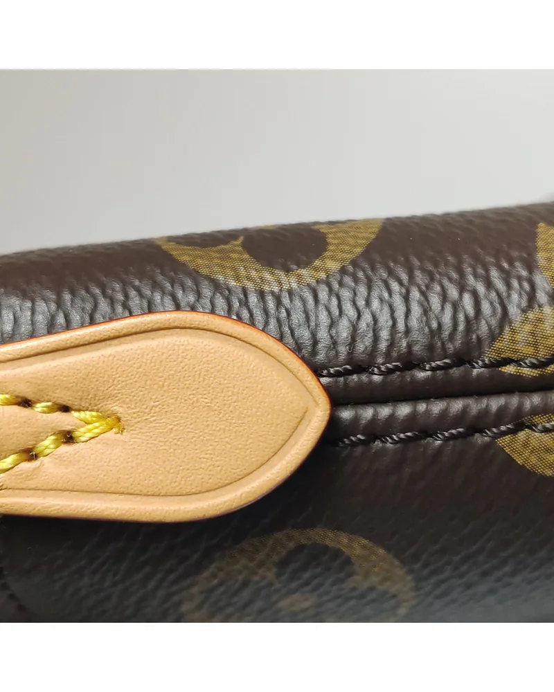 Louis Vuitton Nano Boulogne, close up light wear on the natural leather trim
