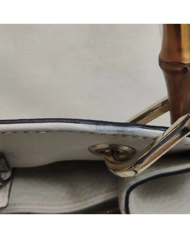 Gucci Bamboo Medium, close up light pressure marks on the body and the front