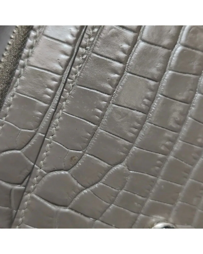 Saint Laurent Sunset, Croc-Embossed, close up light marks on the body and the front
