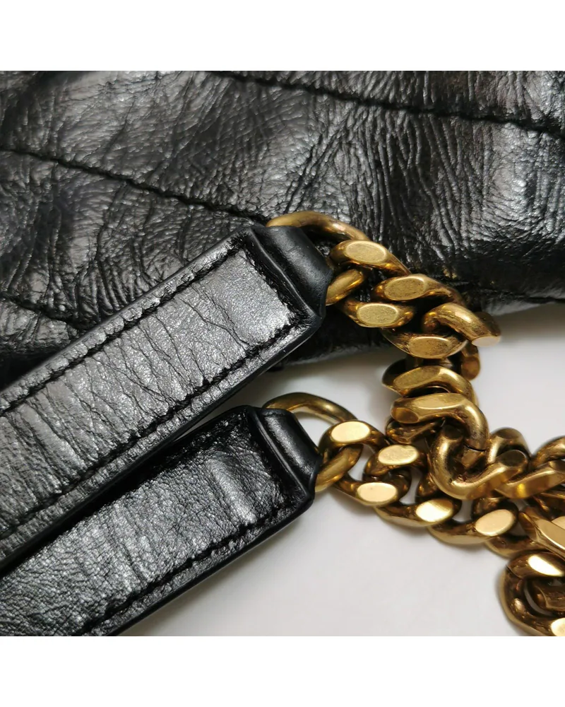 Saint Laurent Niki Medium, close up light wear on the strap