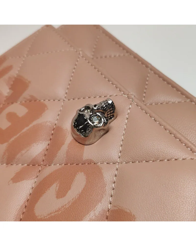 Alexander McQueen Skull Crossbody, close up light wear on the hardware
