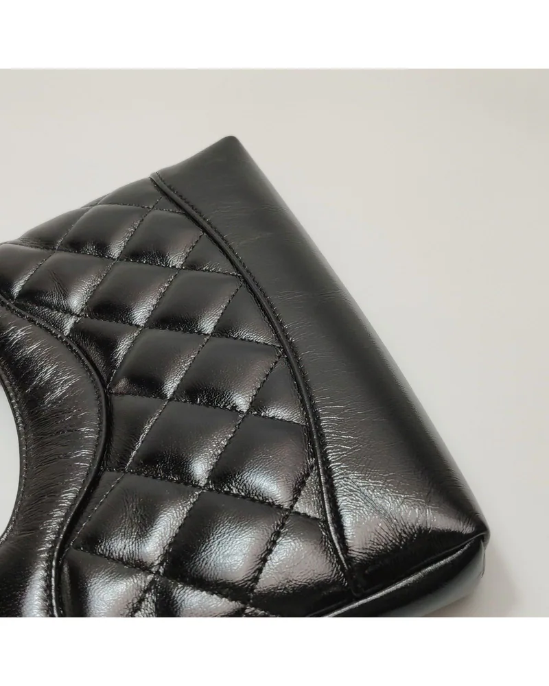 Chanel 31 Bag Nano, close up light wrinkles on the body