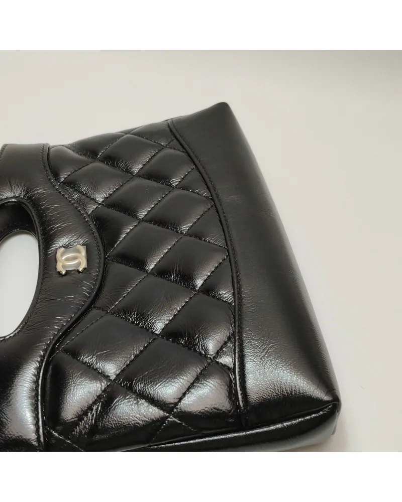 Chanel 31 Bag Nano, close up light wrinkles on the body