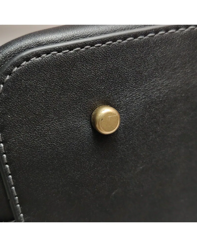 Coach Empire Carryall 26, close up light wear on the base studs