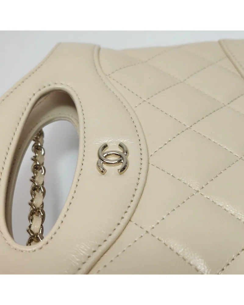 Chanel 31 Bag Nano, close up light wear on the hardware