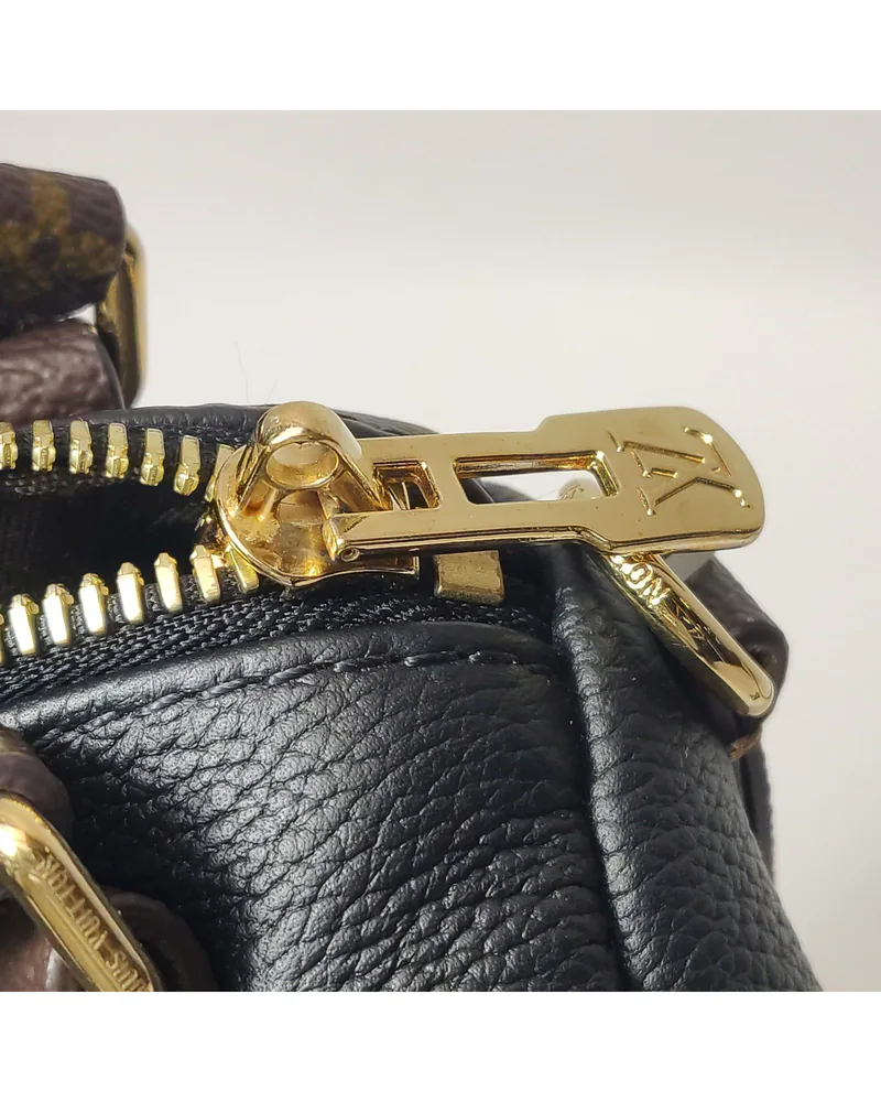 Louis Vuitton Express PM, close up light wear on the hardware