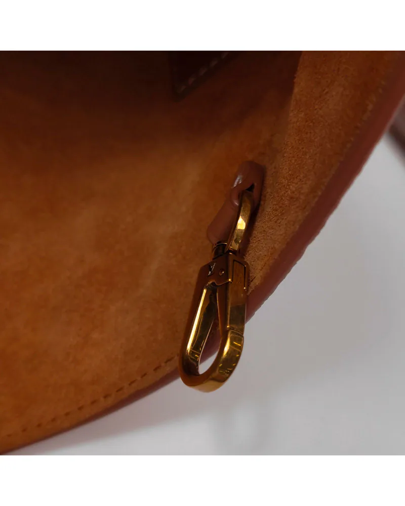 Louis Vuitton Low Key Medium, close up light wear on the hardware