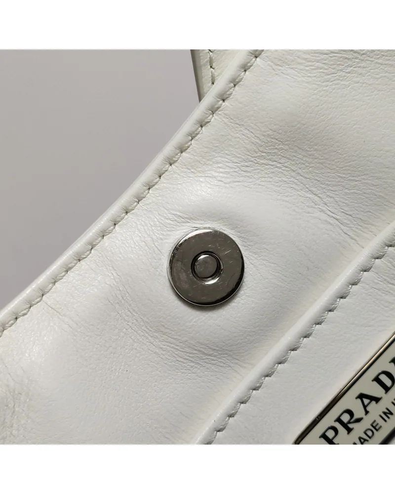 Prada Cleo Medium, close up light wear on the hardware
