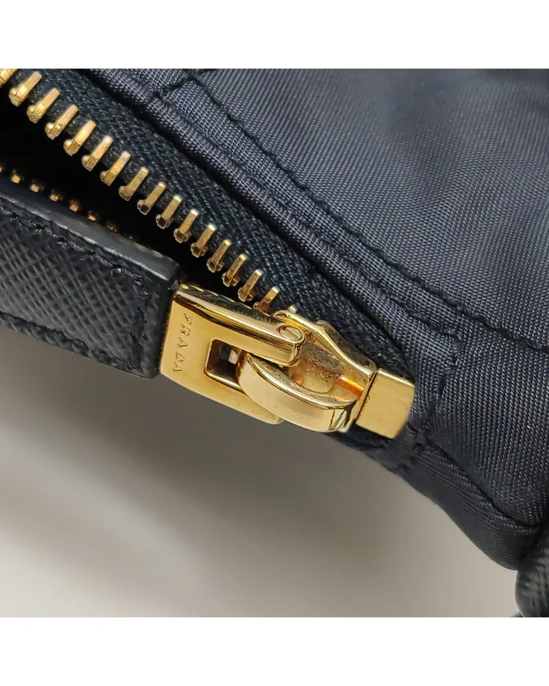 Prada Re-Edition Mini, close up light wear on the hardware