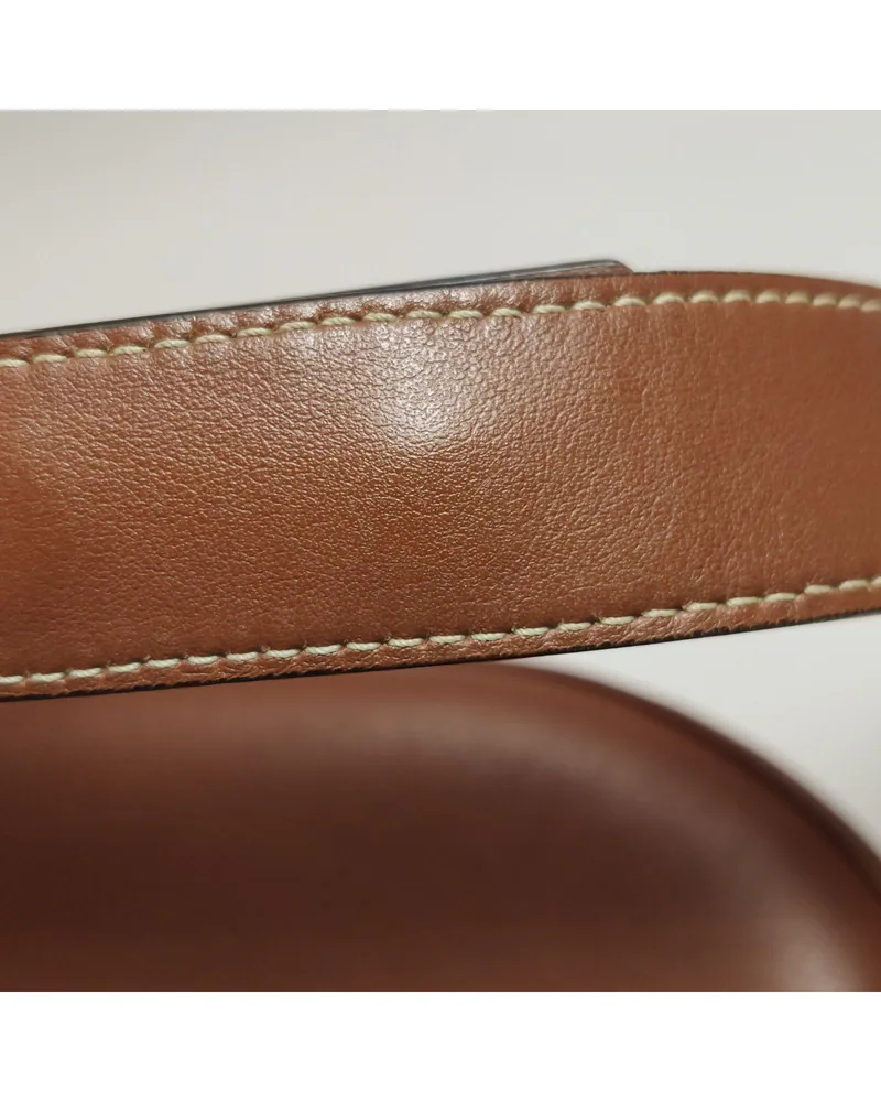 Celine Ava, close up light wear on the strap