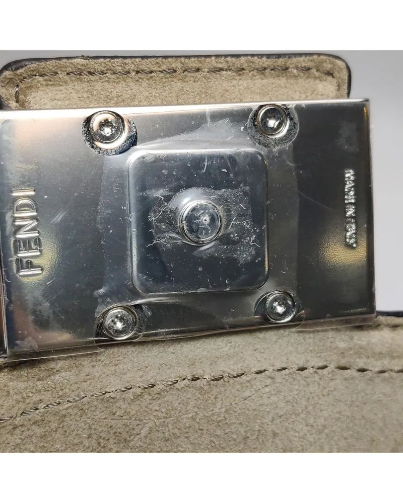Fendi Baguette Trunk, close up light wear on the hardware