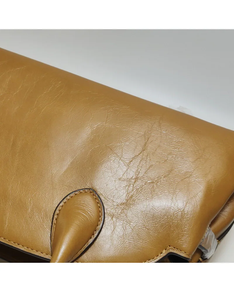 Coach Empire Carryall 34, close up light wrinkles on the body