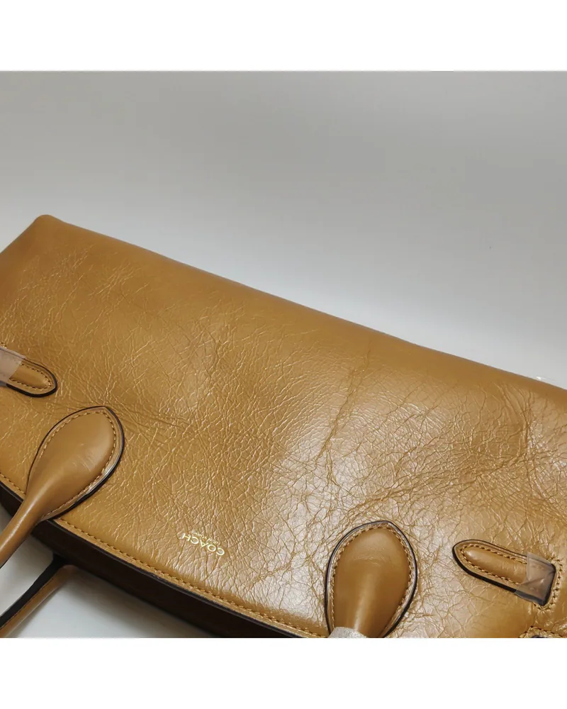 Coach Empire Carryall 34, close up light wrinkles on the body