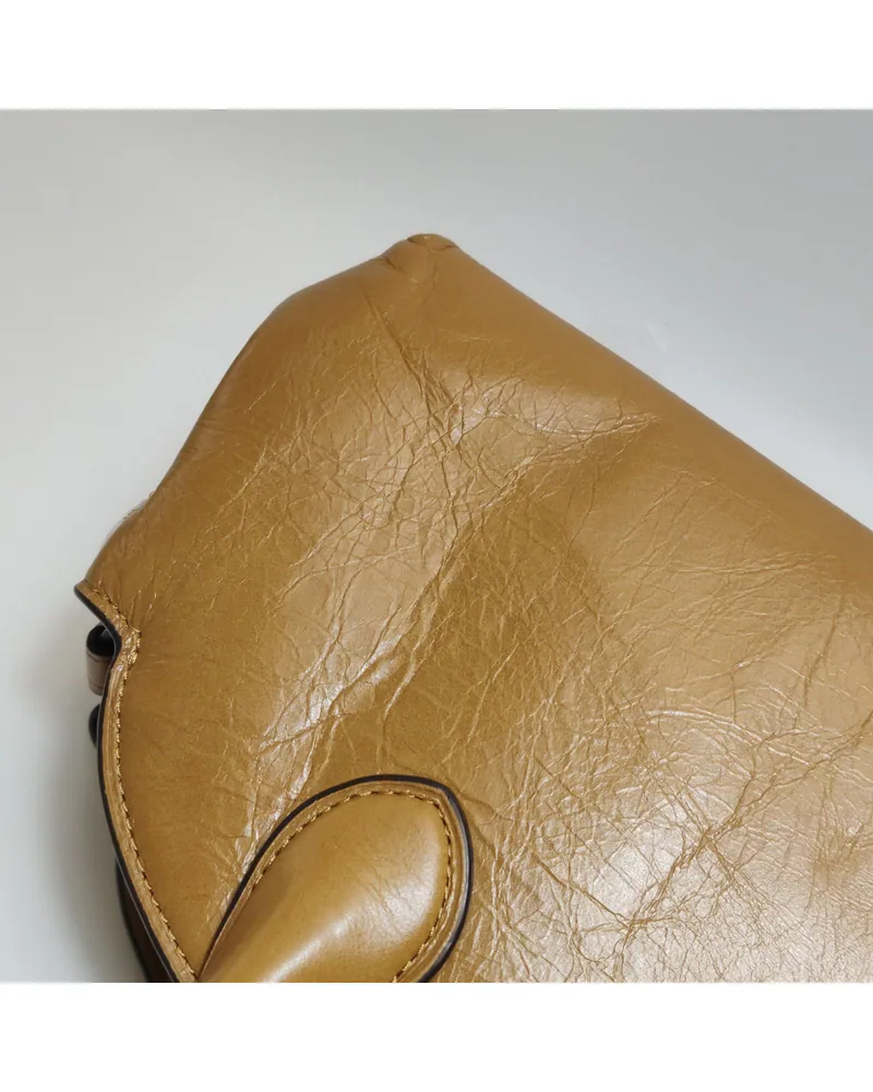 Coach Empire Carryall 34, close up light wrinkles on the body